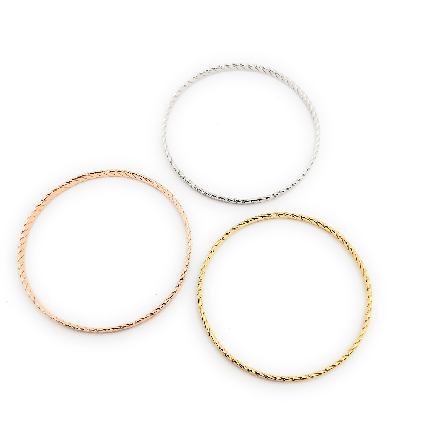 Set de 3 Pulseras Individuales Texturizadas · Oro Amarillo, Plata y Oro Rosa