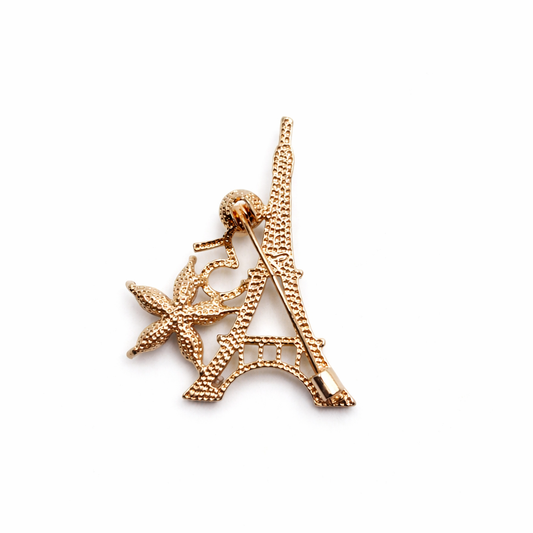 Broche joya dorado beige en forma Torre Eiffel Paris con cristales facetados brillantes y perla