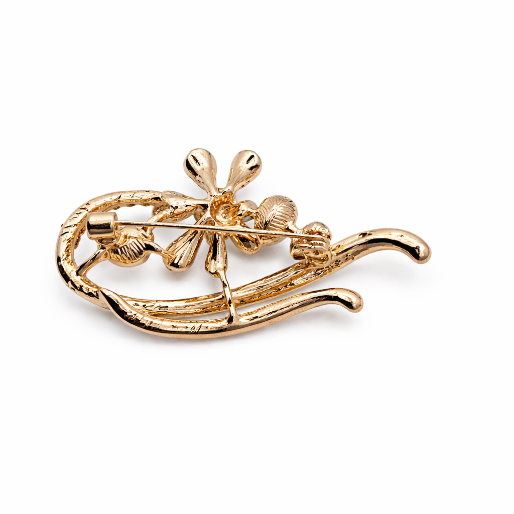 Broche joya dorado elegante flor con cristal facetado burdeos, circonitas brillantes y perla