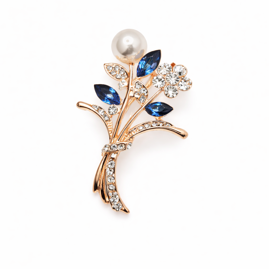 Broche joya floral dorado con detalles en azul, cristales y perla