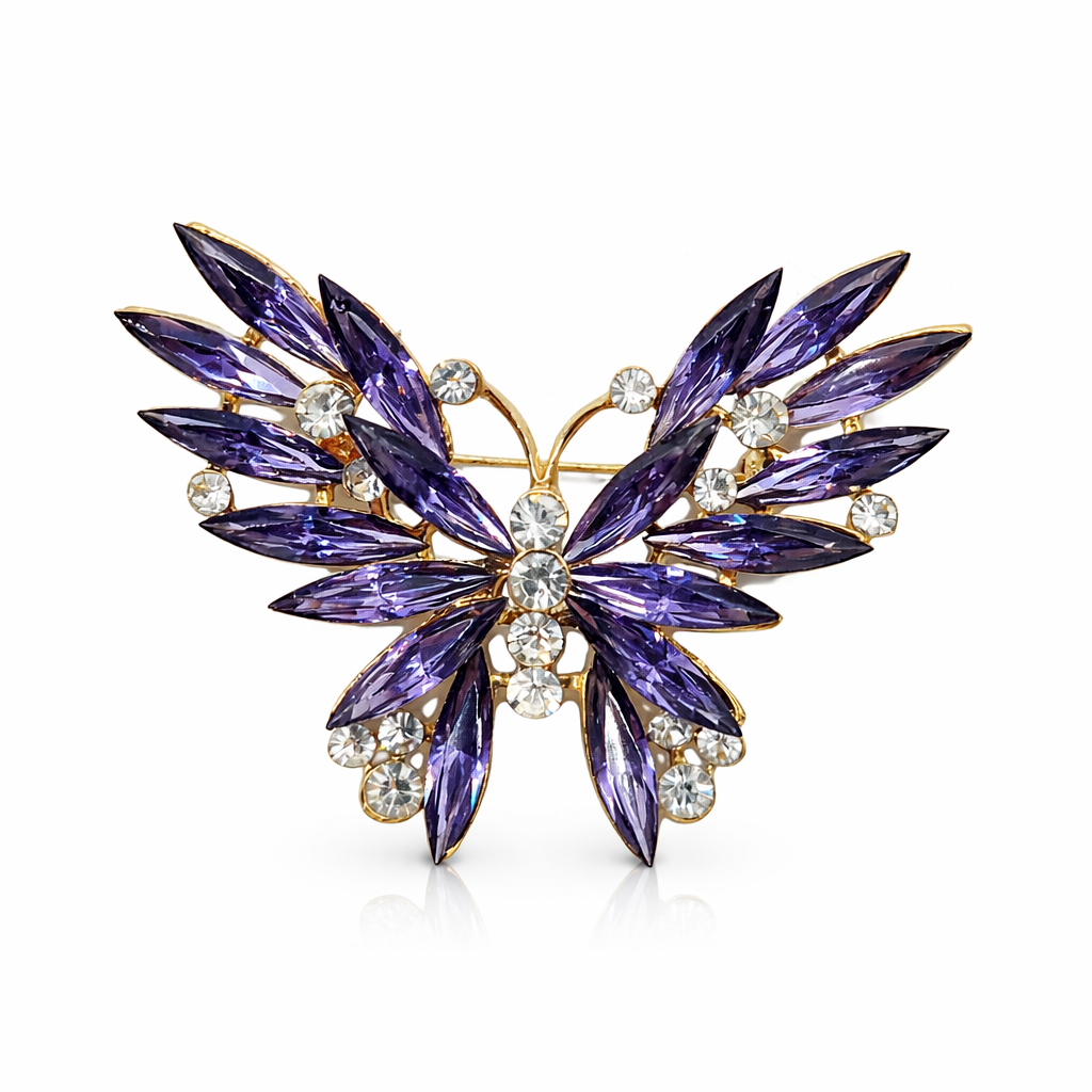 Broche joya de mariposa dorada con cristales morados y circonitas