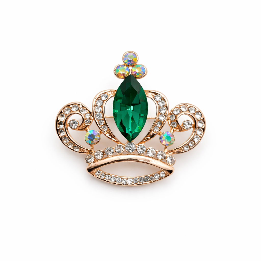 Broche joya dorada en forma de corona con cristal facetado verde y circonitas brillantes