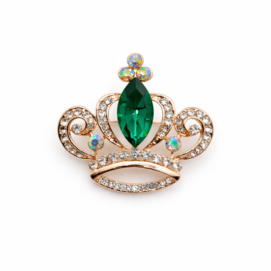 Broche joya dorada en forma de corona con cristal facetado verde y circonitas brillantes