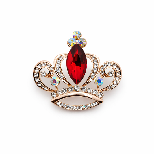 Broche joya dorada en forma de corona con cristal facetado rojo y circonitas brillantes