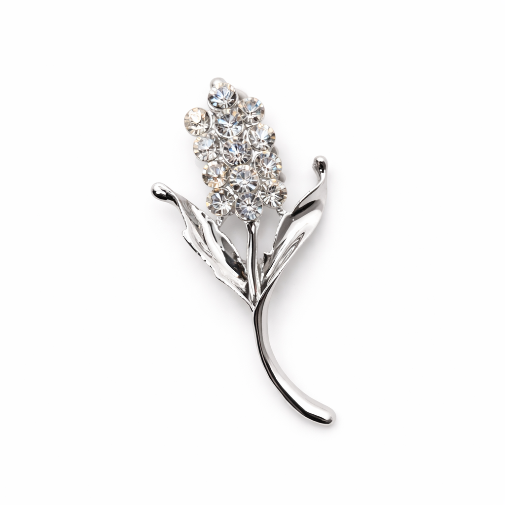 Broche joya plateada en forma de flor con cristales brillantes